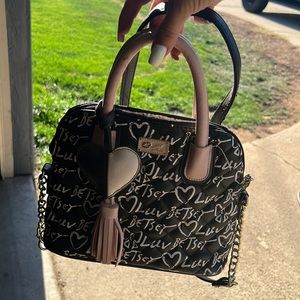 Betsey Johnson purse. Hand held straps or over the shoulder.